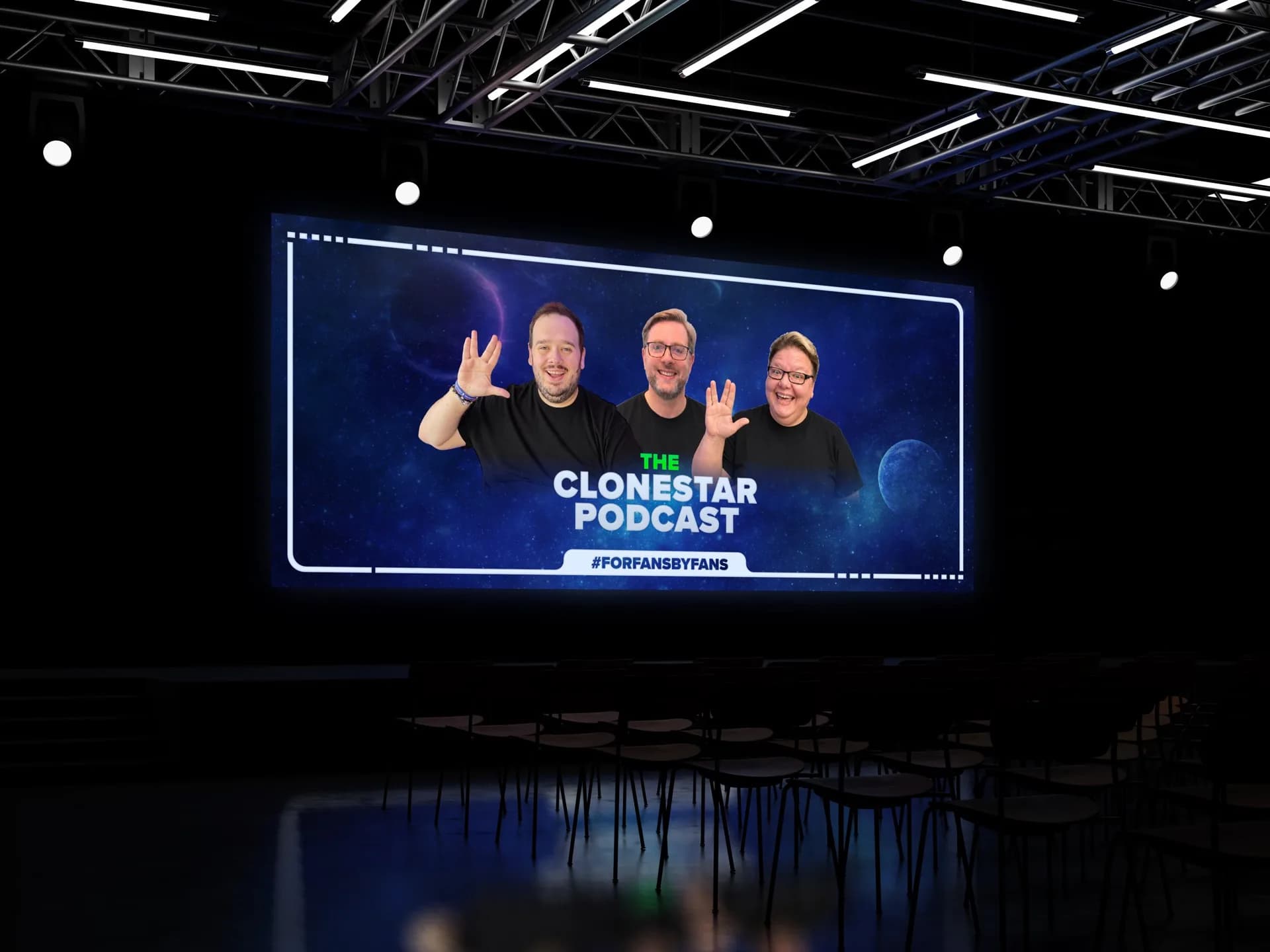 The Clonestar Podcast banner on a big screen in a conference hall, with the three hosts giving the Vulcan salute