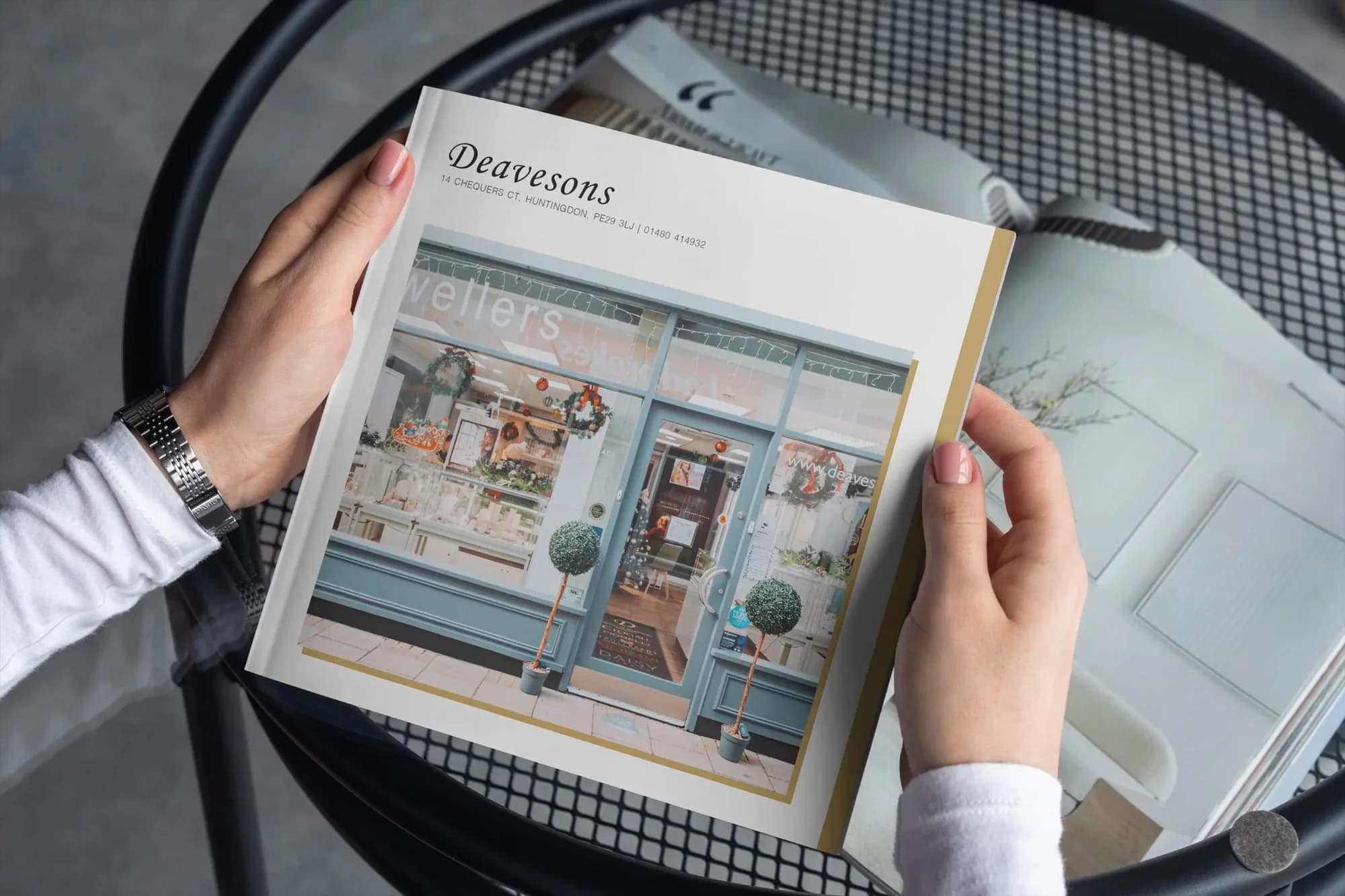 A printed Deavesons brochure with the Huntingdon shop front on the cover