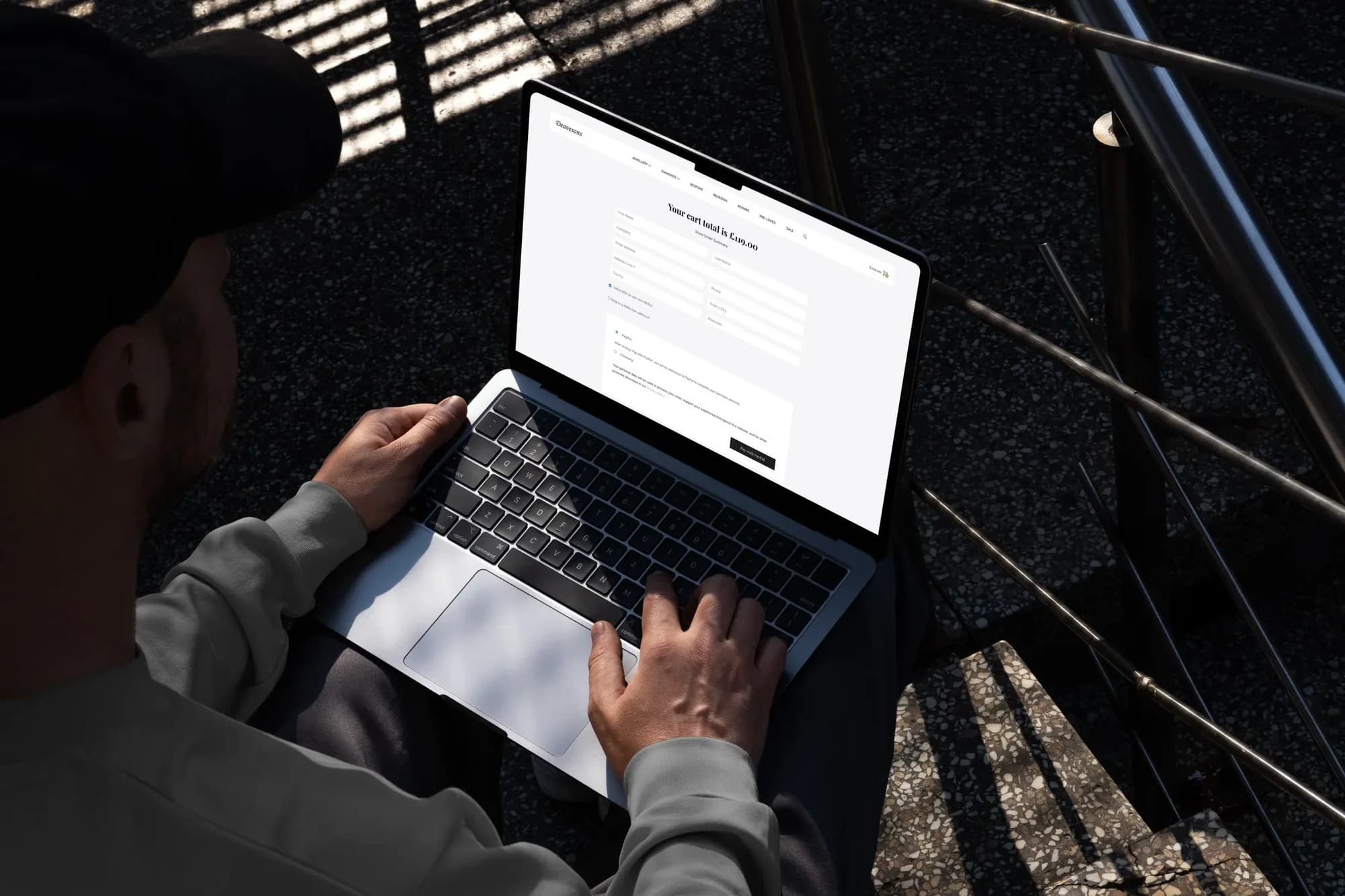 The Deavesons checkout on a laptop, showing the cart total and payment options