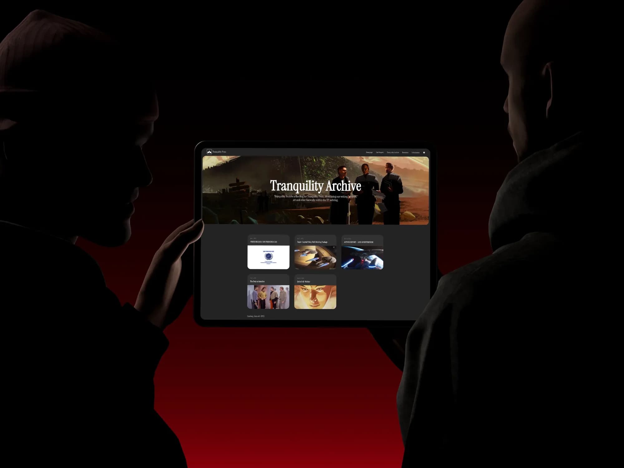 The Tranquility Archive blog on an iPad held between two silhouetted figures