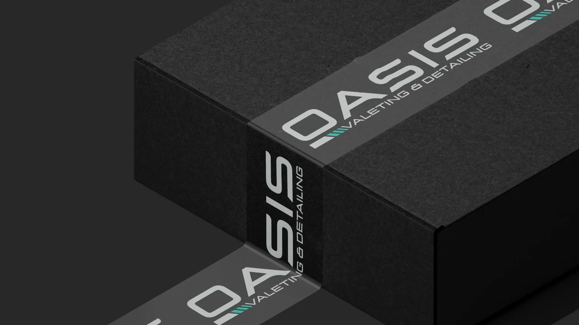 A black box sealed with branded Oasis packaging tape