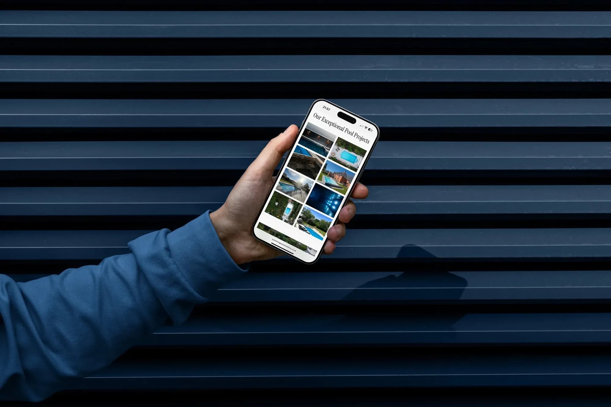 The SPS project gallery on an iPhone held against a navy slatted wall